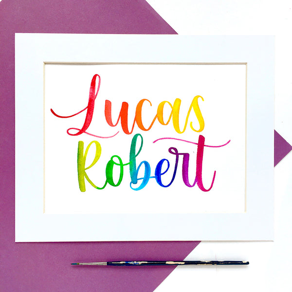 Hand-painted baby name in rainbow watercolour calligraphy
